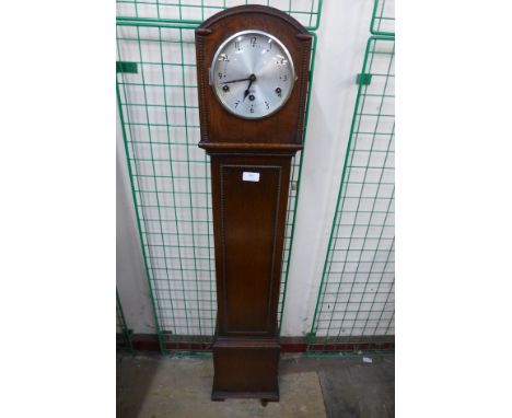 An oak dwarf longcase clock