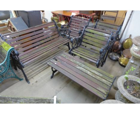 A cast metal five piece garden set