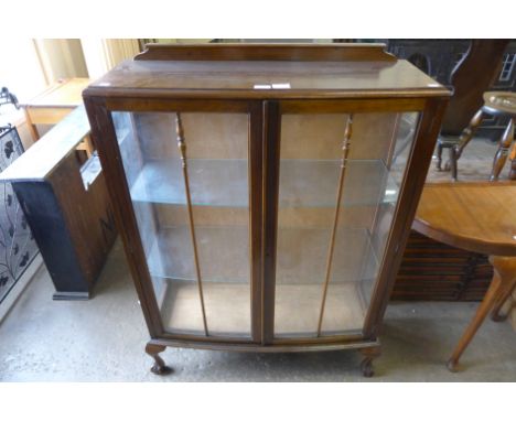 A mahogany bow front display cabinet