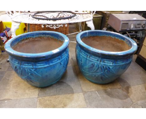 A pair of turquoise glazed garden planters