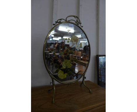 A Victorian painted brass fire screen