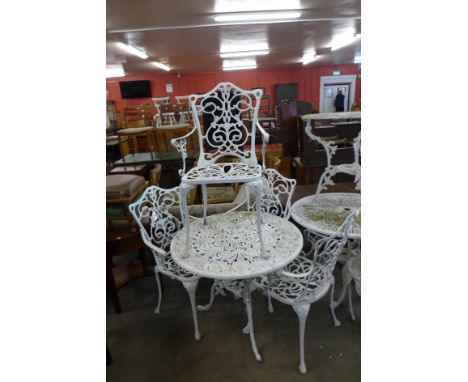 A painted cast alloy garden table and four chairs