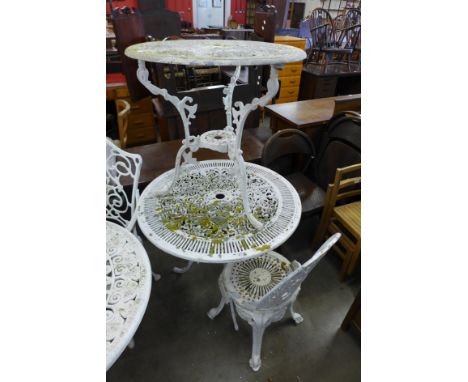 Two cast alloy garden tables and a chair