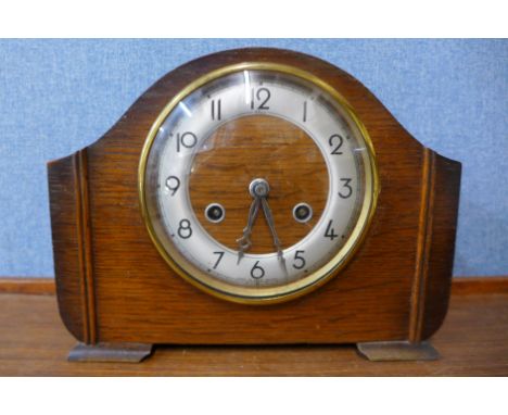 An Art Deco Elco walnut mantel clock