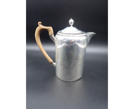 A George III silver Hot Water Jug, engraved crest and presentation inscription, the cover with turned finial, London 1802, ma