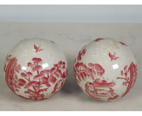 A pair of late 18th/early 19th Century chinoiserie Carpet Bowls, decorated landscapes, with children jumping through hoops am