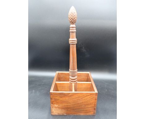 A hardwood four division Bottle Holder with central handle having carved finial, 18in 
