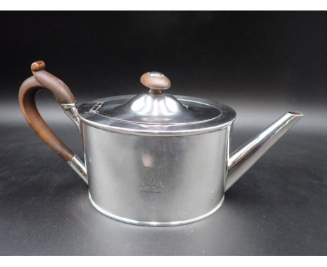 A late 18th Century French silver oval Teapot, with engraved crest, pearwood handle and finial, Paris Marks, maker A.E.G with