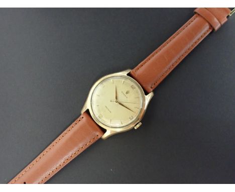 A gentleman's vintage Rolex Precision Wristwatch the champagne dial with arabic numerals at quarters, the remainder chevron m