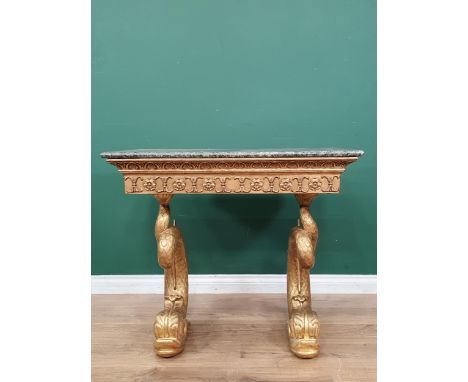 An early 19th Century giltwood Console Table with green marble top, mounted upon carved dolphin supports, A/F, 2ft 11in W x 2