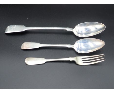 A William IV silver Basting Spoon, fiddle pattern, engraved initials, London 1836, a Table Spoon, Newcastle 1825, and a Dinne