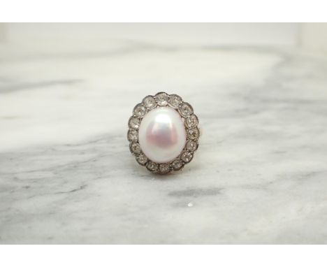A Cultured Pearl and Diamond Cluster Ring the pale rosé pearl within a frame of millegrain-set old-cut stones, unmarked, unte
