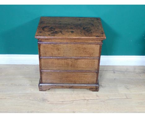 An early 18th Century oak Box Stool/Commode with hinged lid above three simulated drawers on bracket feet, 19½in W 