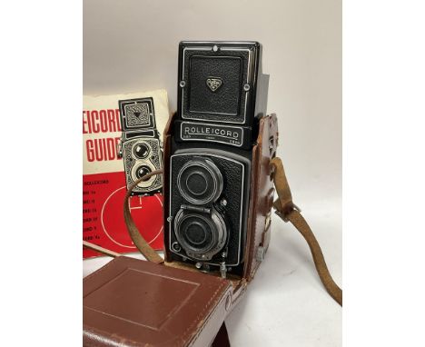 A vintage leather cased Rolleicord TLR camera, with additional case, light meter etc. (C).
