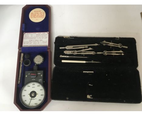 A smiths cased speed tachometer precision measure and a case containing draftsmanship tools (2)
