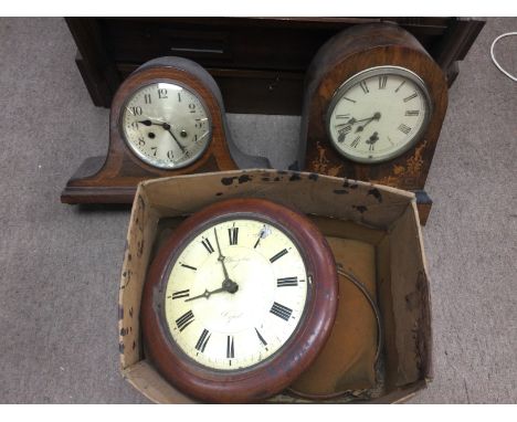 A mahogany circular wall clock, a parquetry mantle clock and one other. Shipping category D.