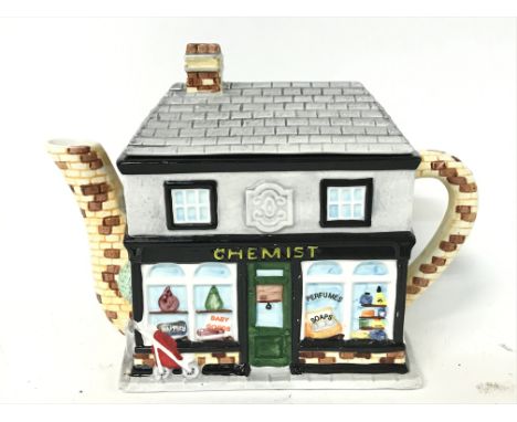 Annie Rowe The village teapot collectables, Chemist. Approximately 17x22cm NO RESERVE