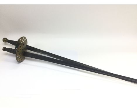 Two conforming late 19th century swords with round brass guards wired grips and straight tapering steel blade, no scabbard, a