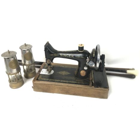 Withdrawn - A singer vintage sewing machine, a pair of Protector miners lamps and vintage walking sticks
