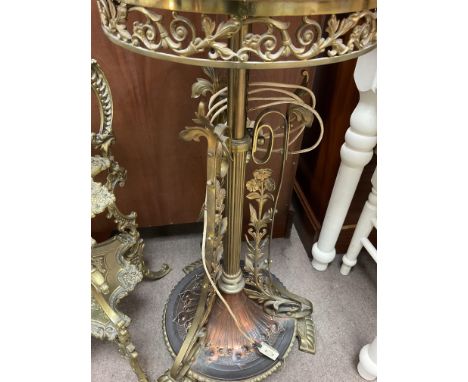 A brass and copper oil standard lamp of Victorian design .