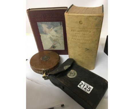 A half leather bound Mrs Beetons book of household management. A book of Fairy-stories a tape measure and a vintage camera. (
