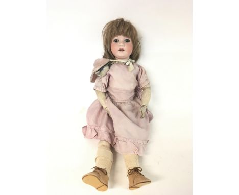 Vintage German doll with a jointed body &amp; a bag of accessories