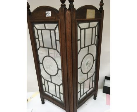 A Mahogany fire screen with lead light panels with applied plaque House of commons.