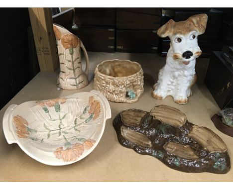 Two Burslem ware pieces including bowl and vase decorated with carnations, together with a Sylvac dog and a tree trunk bowl a