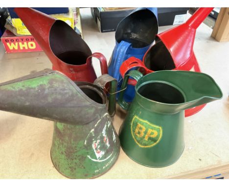 Five various vintage 1/2 gallon motoring oil jugs