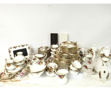 A large collection of Royal Albert Old Country Roses including tea cups, saucers, plates, jugs, cloth with no obvious signs o