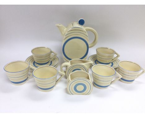 A Clarice Cliff six place setting tea set in blue circle pattern.