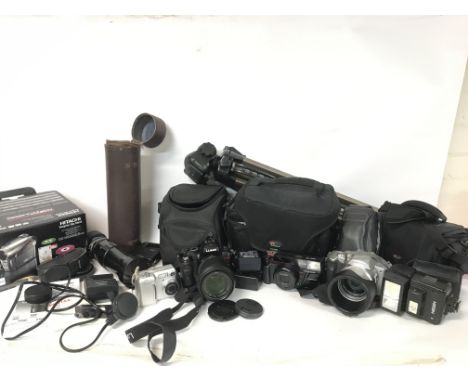 A collection of cased vintage cameras and equipment including Pentax cameras, a boxed Hitachi Hybrid camcorder, a Nikon Coolp