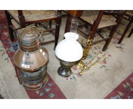 A brass and copper ships lantern Player & Mitchell, Birmingham, together with an oil lamp and fire irons