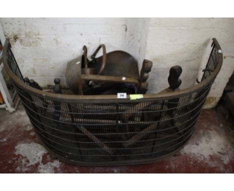 An Edwardian brass firescreen, fire grate and two pairs of cast iron andirons Best Bid