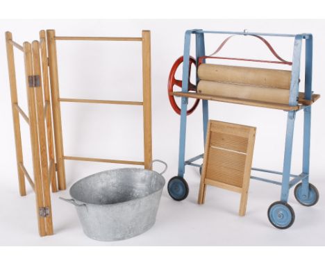 A Lines Bros/Triang doll size 1950s toy washing set. Comprising mangle, washboard, tin bath and wooden clothes horse within a