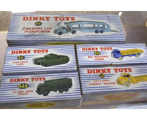 Five boxed Dinky diecast vehicles, including the 582 Pullmore Car Transporter, the 533 Leyland Cement Wagon, the 922 Big Bedf