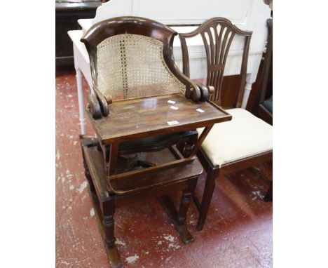 An Edwardian revolving bookcase, a white painted dressing table, a Victorian child's high-chair, an early 19th century mahoga