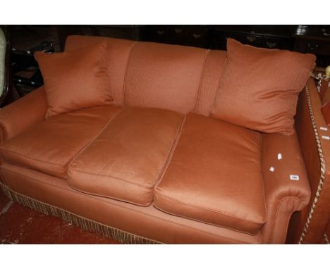 An upholstered three seat sofa, early 20th century