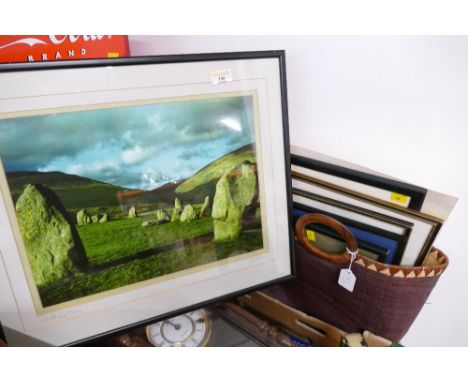 Basket of mixed pictures and photograph frames and mounted and framed print of Castlerigg Stone Circle 