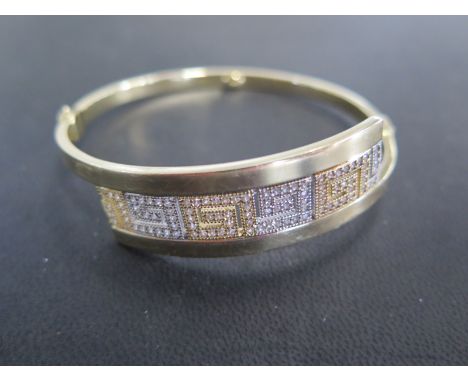 A 14ct yellow gold bangle - approx weight 13.5 grams - Width 6.5cm x 6cm - marked AVORT TSE 585 - clean condition, minor usag