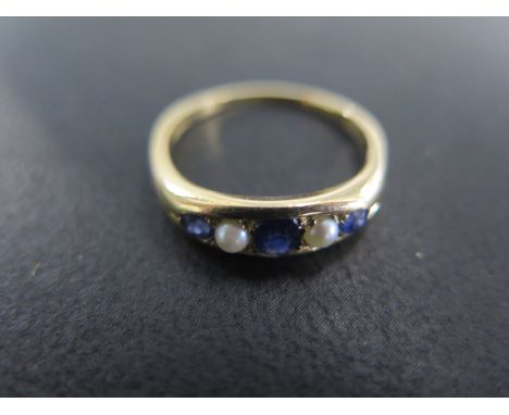 An 18ct yellow gold sapphire and pearl ring size N - approx weight 4.2 grams - light usage wear 