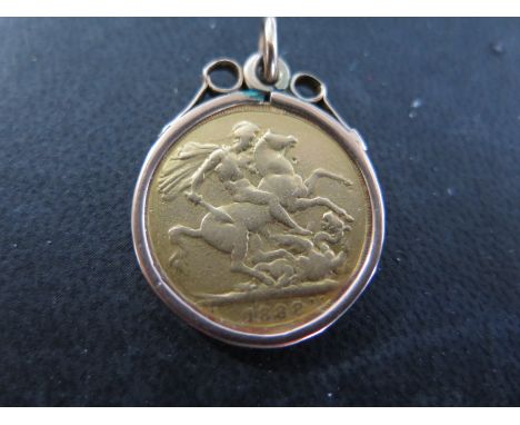 A Victorian full Sovereign dated 1888 in a 9ct yellow gold mount with suspension ring - coin has wear relevant to age - total