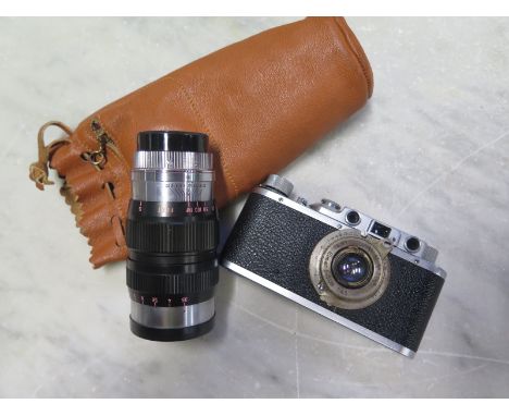 A Leica Leitz II (D) circa 1938 rangefinder camera complete with a 5cm 3.5 Elmar and an additional super-Acall 135mm 3.5 lens