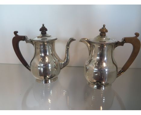 A Mappin and Webb silver teapot and water jug Birmingham 1926/27 - Height 14cm - approx total weight 15.9 troy oz - both with