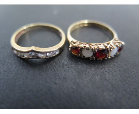 A 9ct yellow gold garnet and opal ring size K - approx weight 2.4 grams and a 9ct yellow gold and cubic zirconia ring size k 