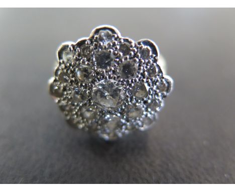 An 18ct gold diamond cluster ring size N - approx weight 6.5 grams - some light scratches, usage wear 