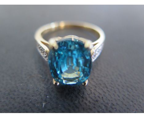 A 9ct gold blue zircon and white topaz ring size R - approx weight 4.7 grams - very light scratches, usage wear 