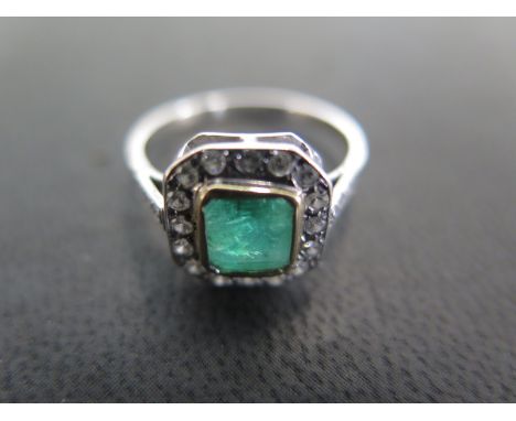 An 18ct white gold emerald and diamond ring size N - approx weight 2.8 grams - some light usage wear otherwise good condition