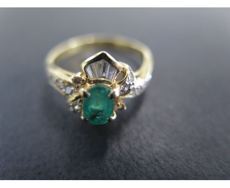 An 18ct yellow gold emerald and baguette cut diamond ring size Q - approx weight 3.7 grams - light usage wear 