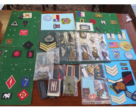A large selection of Military cloth badges including Army, Navy RAF, US Navy and US Airforce 
